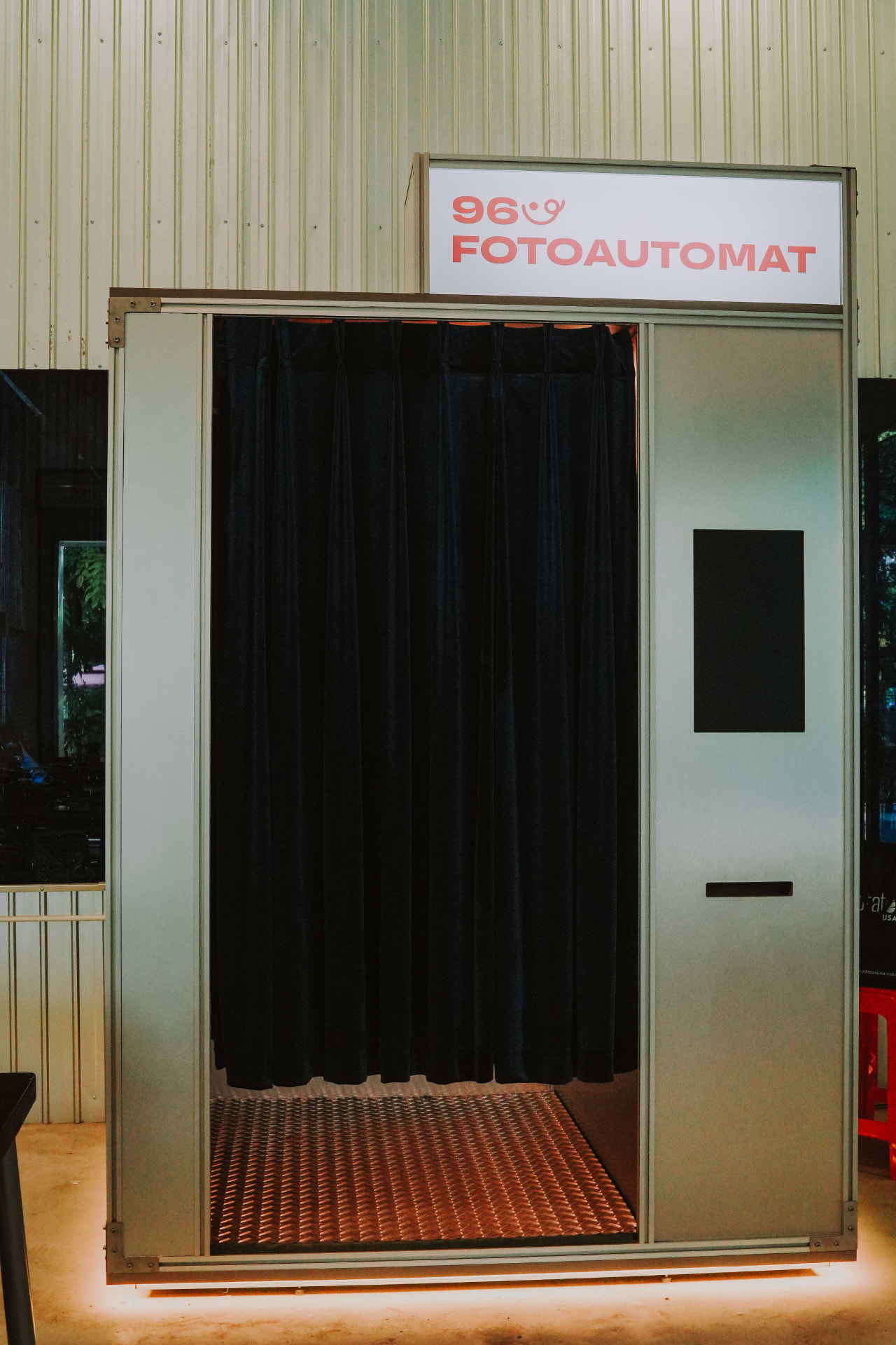 Enclosed 96 Fotoautomat photobooth installed inside a stylish restaurant