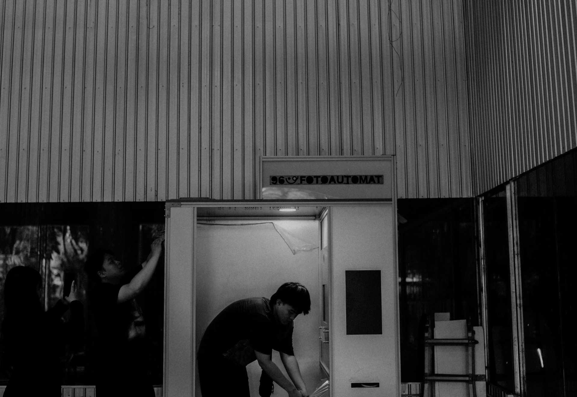 Technicians installing a 96 Fotoautomat photobooth at the workshop