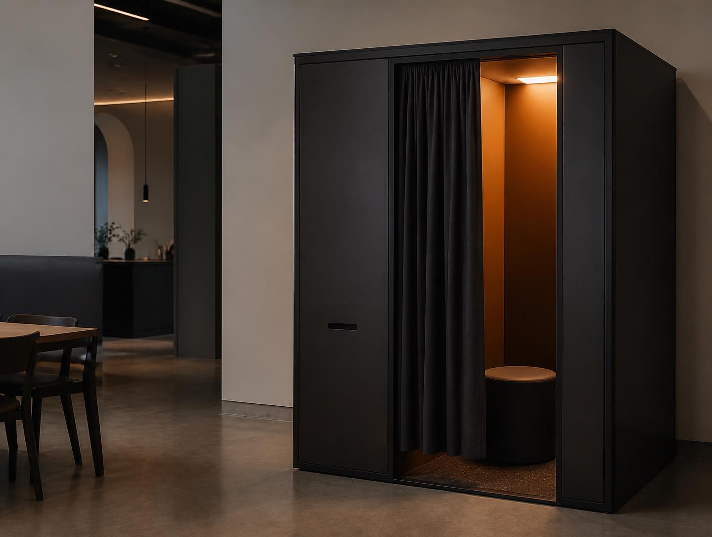 Enclosed photobooth with curtain installed in a minimal restaurant